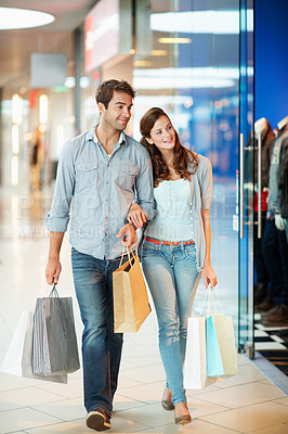 Buy stock photo Walk, shopping and search with couple in mall for retail promotion, boutique sales and love. Support, store deal and consumer product with man and woman with bags for customer, smile and discount