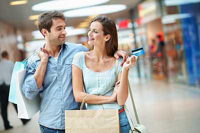 Buy stock photo Mall, hug and happy couple with shopping bag or credit card for payment, purchase or banking. Woman, man or embrace with smile, debit or gift for financial care or relationship in commercial center