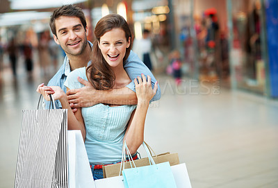 Buy stock photo Portrait, hug and happy couple with shopping bag in mall for love, purchase or spending together. Excited, man and woman with smile, gifts or embrace in commercial center or store for bonding or care