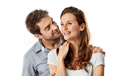 Buy stock photo Man, woman and whisper with laugh in studio for funny conversation, care and smile on white background. Happy couple, connection and embrace with bonding, story or talk for gossip with relationship