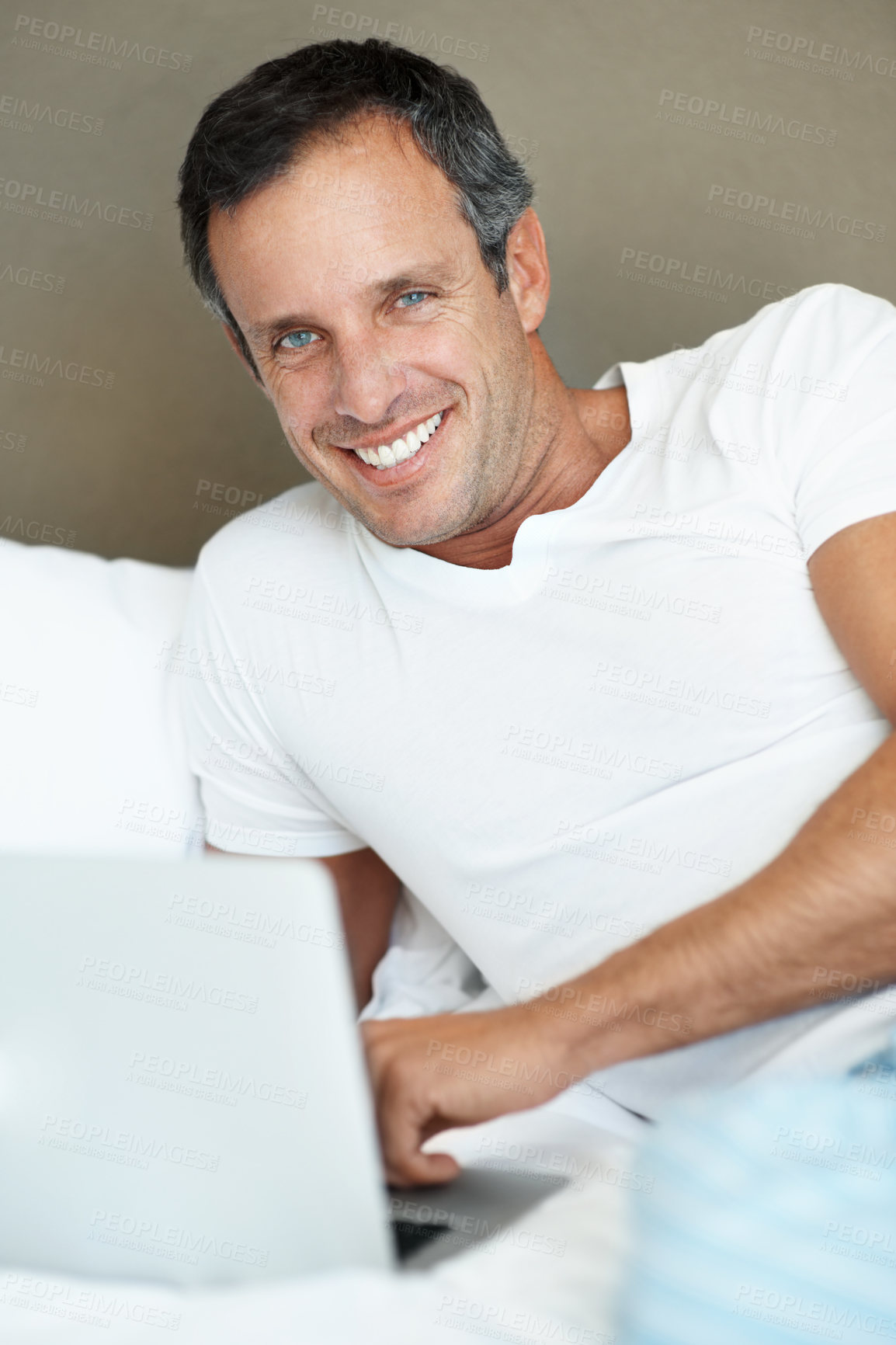Buy stock photo Happy, man and portrait with laptop on bed for email feedback, planning schedule and remote work. Freelancer, mature person and tech in home for calendar update, productive morning or online research