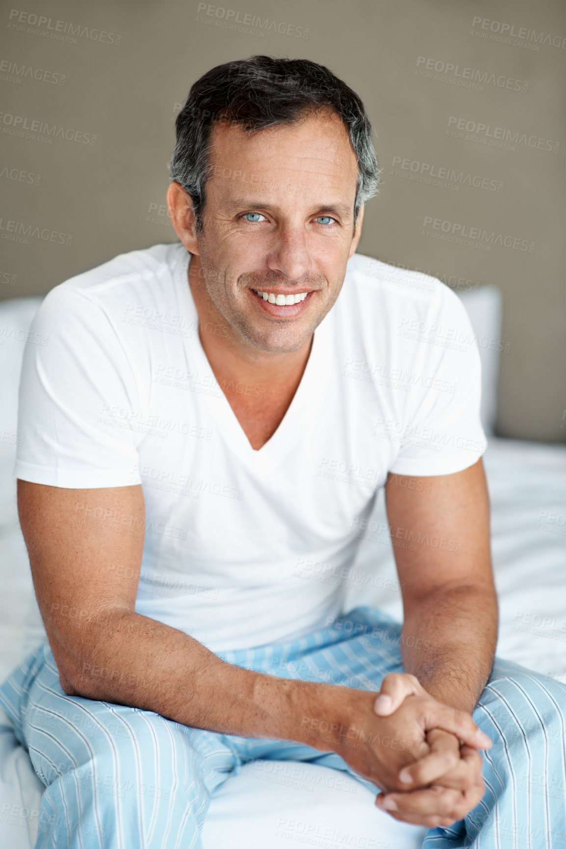 Buy stock photo Relax, man and happy in portrait on bed for peaceful morning, comfortable rest and wellness. Calm, mature person and smile in home for weekend break, positive attitude or unwind on day off in bedroom