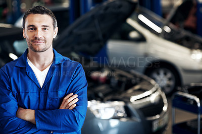 Buy stock photo Crossed arms, smile and portrait of mechanic in workshop with confidence for repairs on car. Man, professional and automotive technician with pride for vehicle maintenance at garage in London.