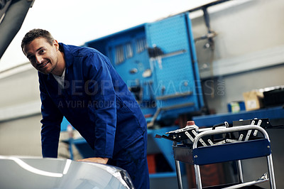 Buy stock photo Portrait, mechanic and happy man with car, fix and transportation maintenance at garage. Repair shop, auto technician and person by vehicle hood for service, motor inspection and engine diagnostic