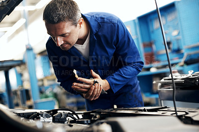 Buy stock photo Car service, man or cleaning hands in workshop for auto repair, routine maintenance or oil change. Cloth, mature mechanic and vehicle inspection for fluid quality, motor grease and diagnostic testing