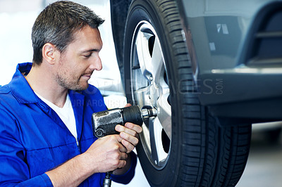 Buy stock photo Workshop, mechanic and man with tools for tire alignment, repair and maintenance for auto service. Garage, technician and person with equipment for fixing, installation and inspection for vehicle