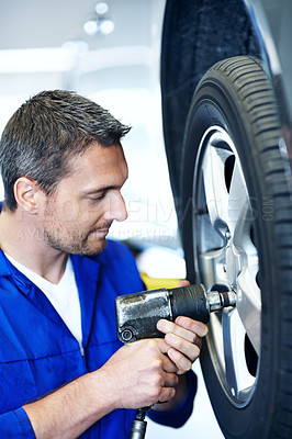 Buy stock photo Workshop, drill and man with tools for tire alignment, repair and maintenance for auto service. Garage, technician and mechanic with equipment for fixing, installation and inspection for vehicle