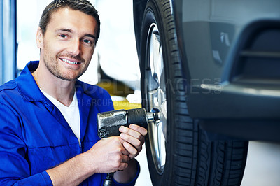 Buy stock photo Workshop, portrait and man with tools for tire alignment, repair and maintenance for auto service. Happy, mechanic and person with power drill for fixing, installation and inspection for vehicle