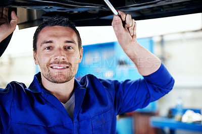 Buy stock photo Mechanic, portrait and tool with man in garage for automobile maintenance or repair. Service, transportation and undercarriage with engineer in vehicle workshop for professional check or inspection