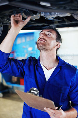 Buy stock photo Mechanic, man and car inspection with clipboard in workshop for exhaust leak, damage or compliance. Vehicle, mature technican and notes for routine maintenance, roadworthy checklist and service quote