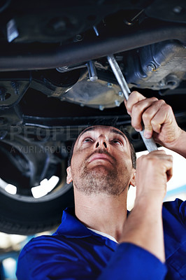 Buy stock photo Tools, technician or man with car for maintenance, fix and problem solving in auto workshop. Equipment, motor mechanic or person under vehicle for service, transmission inspection or repair at garage