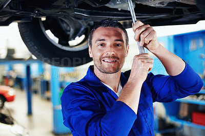 Buy stock photo Mechanic, portrait and wrench with man in garage for automobile maintenance or repair. Car, service tool and transportation with engineer in vehicle workshop for professional check or inspection