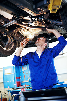 Buy stock photo Fix, lamp and maintenance with man in garage for vehicle inspection, repair or service. Car, light and undercarriage with mechanic in automobile workshop for check, compliance or engineering job