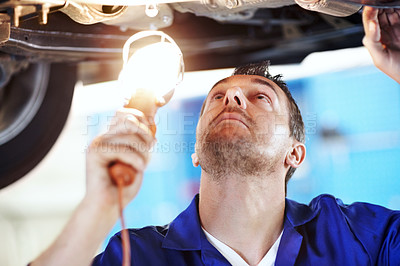 Buy stock photo Car, lamp and repair with man in garage for vehicle inspection, maintenance or service. Exhaust, light and undercarriage with mechanic in automobile workshop for check, compliance or engineering job