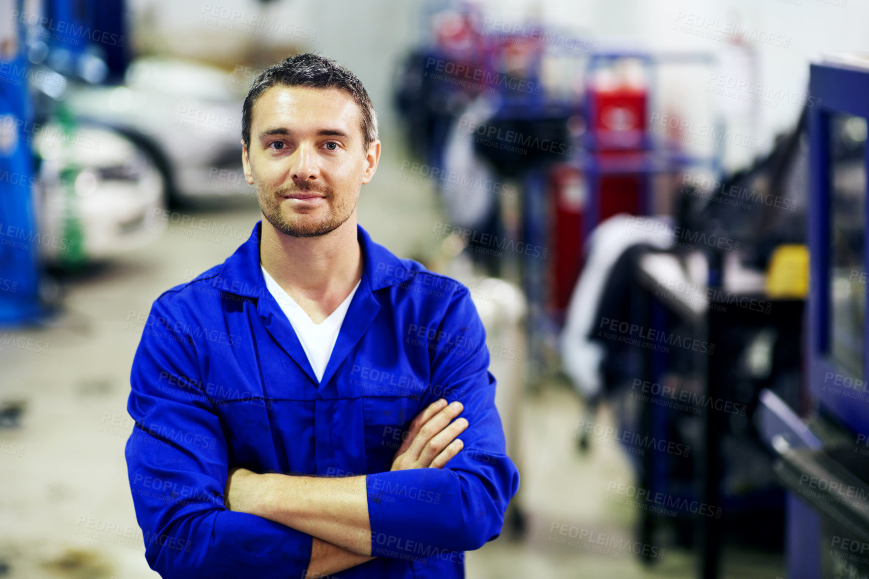 Buy stock photo Portrait, man and mechanic in workshop with arms crossed, smile and pride for engineering career. Happy, confident and garage for car repair, maintenance and auto or vehicle service specialist