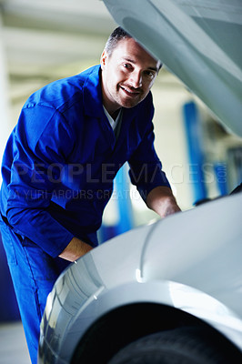 Buy stock photo Portrait, mechanic and happy man by car hood, fix and transportation maintenance at garage. Repair shop, auto technician and person with vehicle for service, motor inspection and check engine bay