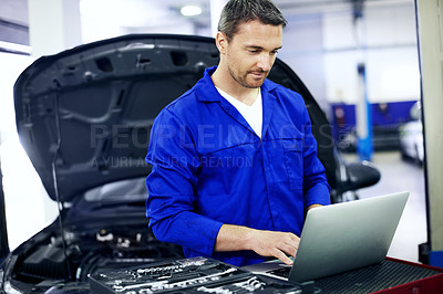 Buy stock photo Man, laptop and car mechanic in workshop with maintenance, typing quote and cost of repair service. Technician, person and research in startup with computer, fix vehicle and report expenses for job.