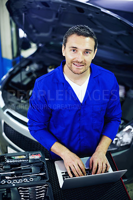 Buy stock photo Above, portrait and mechanic with laptop in workshop, diagnostic testing or car maintenance. Man, smile and vehicle service with technology for auto software, repair or fix automobile at garage