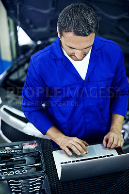 Buy stock photo Car, laptop and typing with mechanic in garage for diagnostics, feedback and review. Computer, digital report and quotation with engineer man in vehicle workshop for maintenance, repair or service