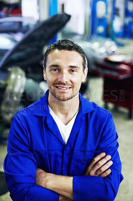 Buy stock photo Portrait, man and mechanic in garage with arms crossed, smile and pride for engineering career. Happy, confident and workshop for car repair, maintenance and auto or vehicle service specialist