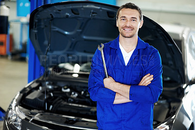 Buy stock photo Man, spanner or mechanic in portrait with arms crossed, repair service or about us for maintenance. Repairman, confident or car in garage for quality assurance, care or diagnostics in small business