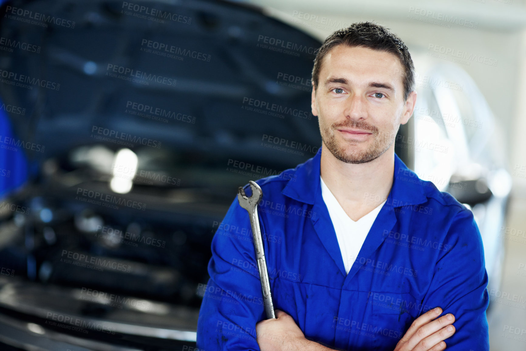 Buy stock photo Portrait, tool or car mechanic in workshop with arms crossed, ambition or pride as repair technician. Service, smile or automatic engineer with wrench, confidence or about us in vehicle maintenance.