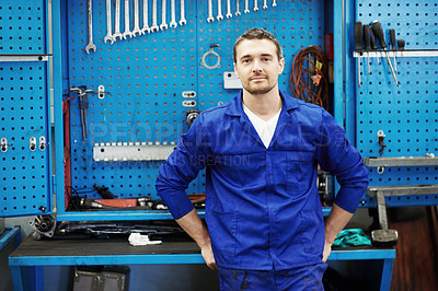 Buy stock photo Portrait, mechanic and man in workshop with tools, repair skills or entrepreneur for small business. Confident, person or technician in startup with equipment, maintenance job or about us for company