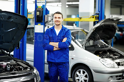Buy stock photo Crossed arms, man and portrait of mechanic in workshop with confidence for repairs on car. Happy, about us and male automotive technician with pride for vehicle maintenance at garage in London.