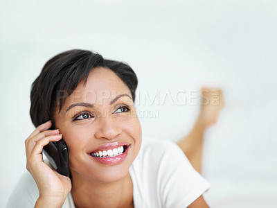 Buy stock photo Phone call, space and thinking with woman on bed in home for conversation, ideas or planning. Comfortable, communication and smile with happy person in apartment bedroom for break, me time or relax