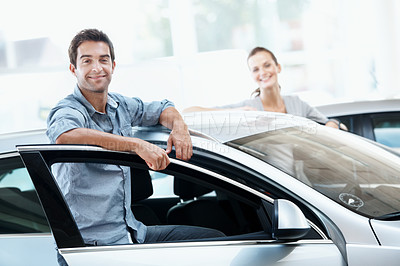 Buy stock photo Couple, portrait and smile in car dealership for vehicle purchase, appointment and customer service. Loan approval, showroom and people shopping for motor, retail and investment for transportation