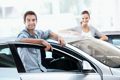 Buy stock photo Couple, portrait and happy in car dealership for vehicle purchase, appointment and auto sale. Loan approval, showroom and people shopping for motor rental, retail and investment for transportation