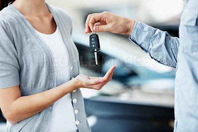 Buy stock photo Hands, keys and salesman in dealership for new car, ownership and approved rental agreement. Woman customer, dealer and vehicle in showroom with sale, purchase and handover for hire or investment