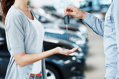 Buy stock photo Hands, keys and salesman in showroom for new car, ownership and approved rental agreement. Woman customer, dealer and vehicle in dealership with sale, purchase and handover for hire or investment