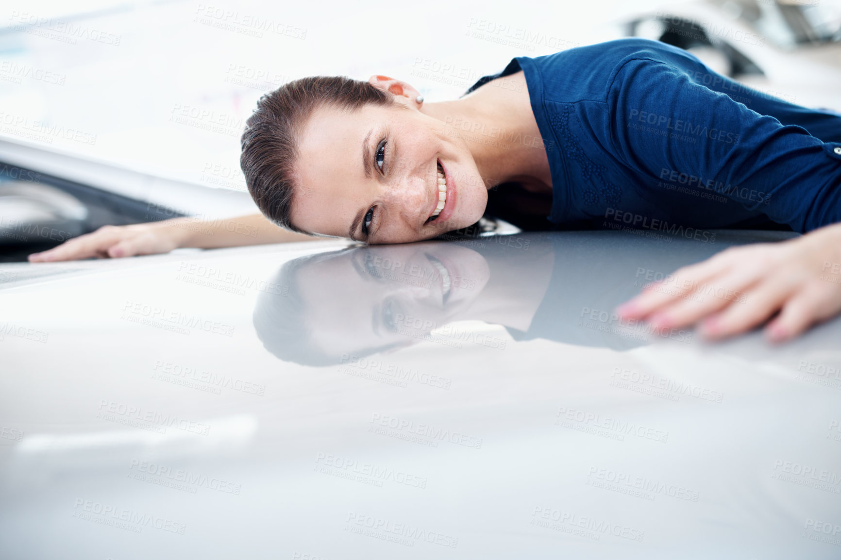 Buy stock photo Hood, hug and portrait of woman at car dealership for satisfaction with choice or purchase. Bonnet, consumerism and vehicle finance with excited customer embracing sedan in showroom for gratitude