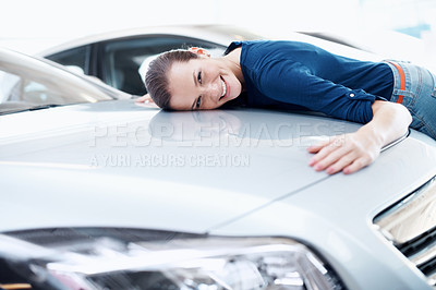 Buy stock photo Bonnet, embrace and portrait of woman at car dealership for satisfaction with choice or purchase. Customer, hood and vehicle finance with excited person hugging sedan in showroom for gratitude
