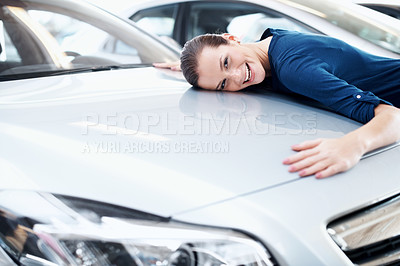 Buy stock photo Bonnet, hug and portrait of woman at car dealership for satisfaction with choice or purchase. Consumerism, hood and vehicle finance with excited customer embracing sedan in showroom for gratitude