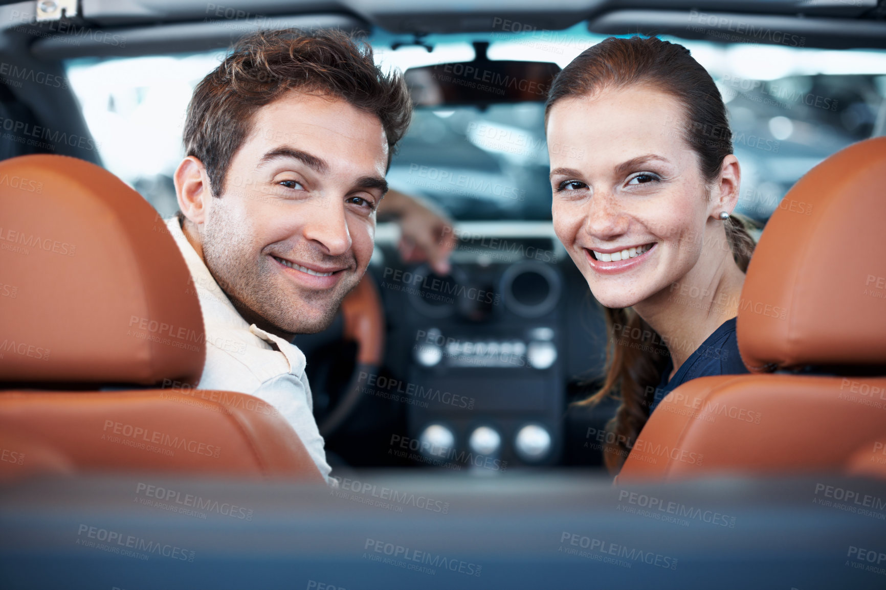 Buy stock photo Car dealership, couple and portrait in convertible for decision, purchase or test drive. Back, satisfaction and smile with happy people in showroom vehicle for consumerism, insurance or finance
