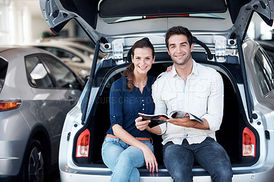 Buy stock photo Couple, portrait and happy at car dealership with pamphlet for purchase, buying and choice of vehicle. Man, woman and smile by trunk for catalog, insurance or showroom for customer or client