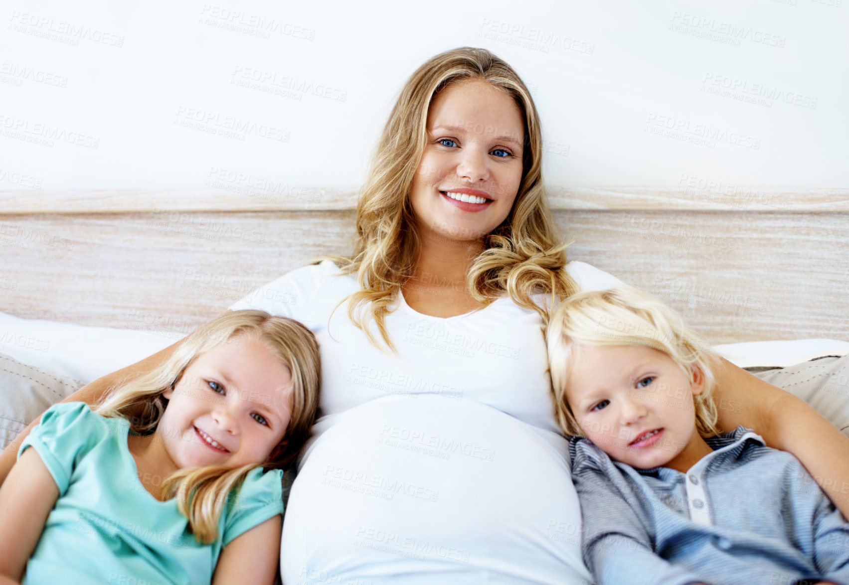 Buy stock photo Sofa, pregnancy and portrait of children with mom for bonding, connection and relationship. Family, home and pregnant woman with kids for embrace, affection and happy for parenting, maternity or love