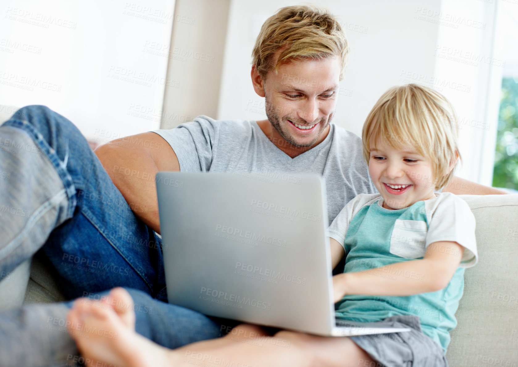 Buy stock photo Laptop, father and happy with child on sofa for streaming, bonding and online cartoon. Connection, love and subscription platform with man and kid in family house for digital entertainment and games