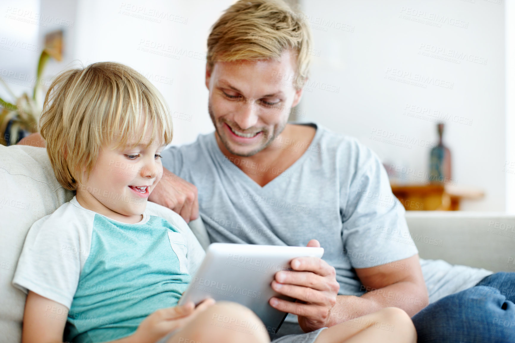 Buy stock photo Tablet, relax and smile with father and son on sofa for streaming service, bonding and movie subscription. Online film, love and multimedia search with man and child in living room of family home