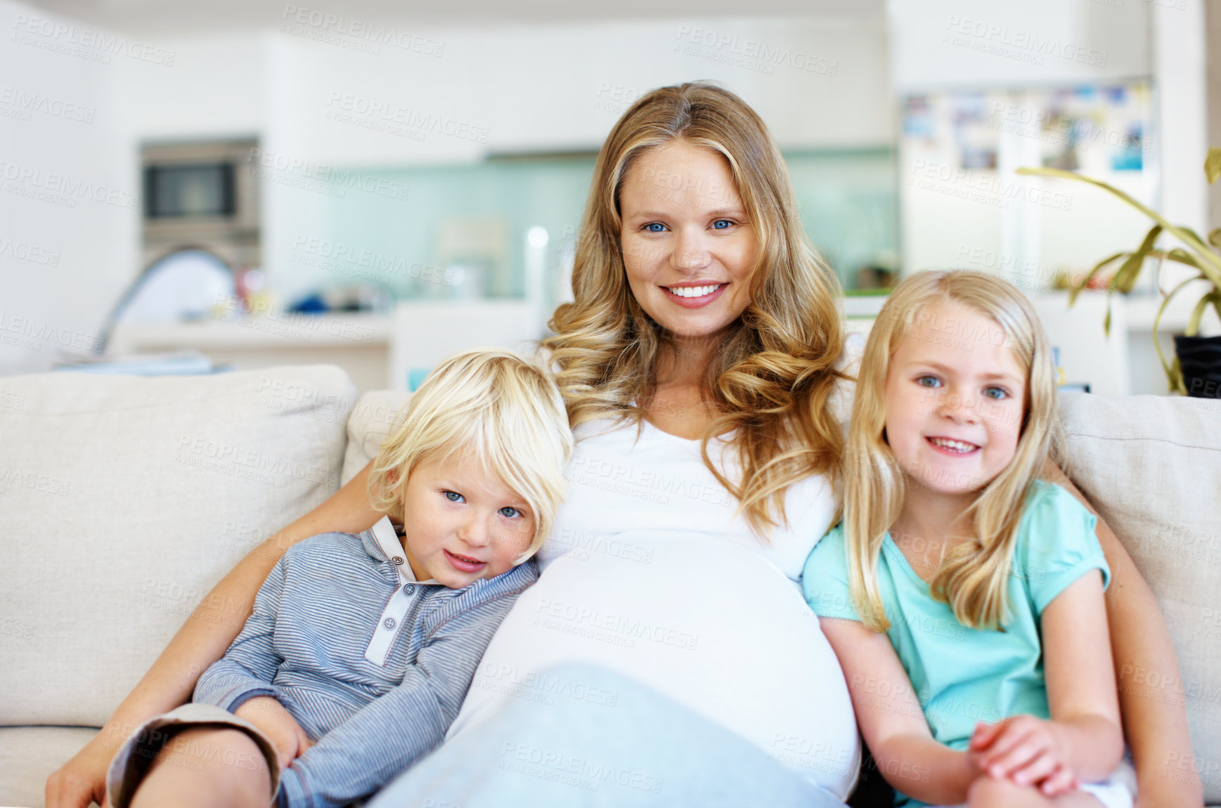 Buy stock photo Pregnant, portrait and mom with children on sofa in home for childhood, growth or siblings. Maternity, mother and kids with smile, hug or belly for parenthood, care or love together on couch in house