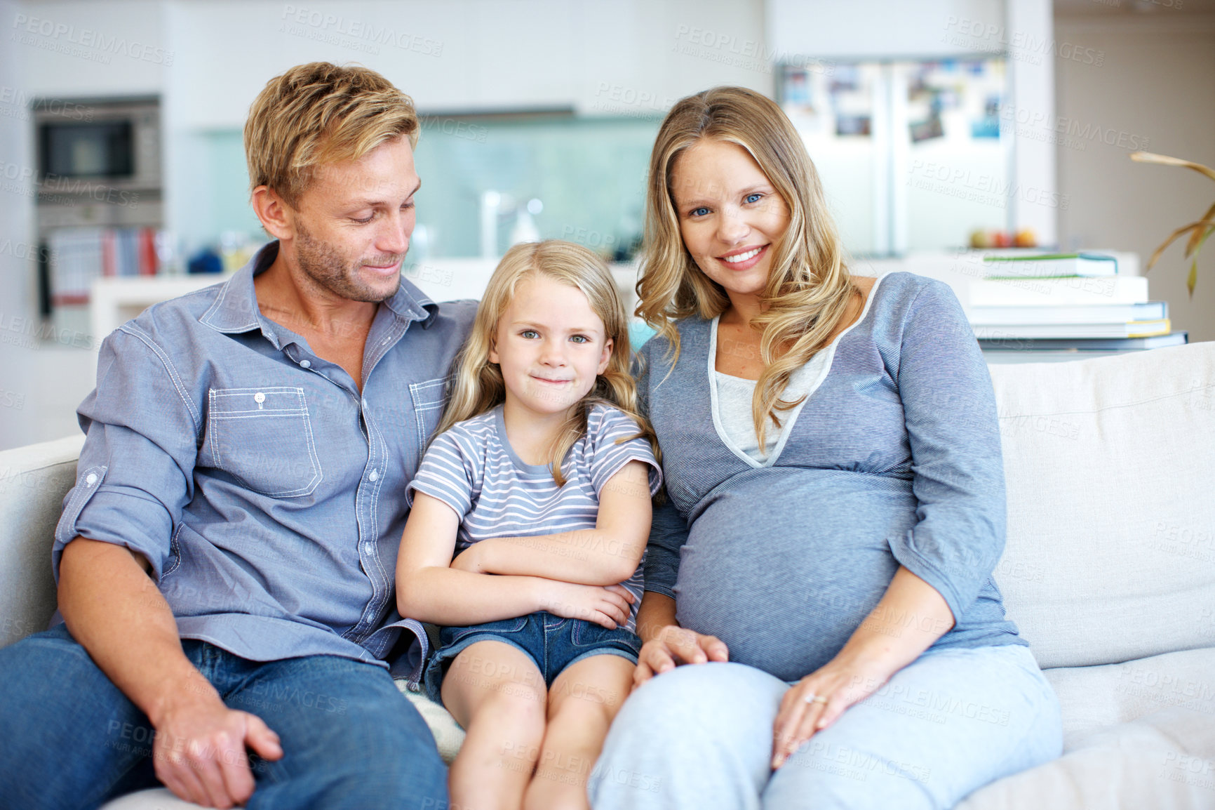 Buy stock photo Happy, pregnancy and security with family on sofa in home living room together for bonding or wellness. Break, development and portrait of girl child in apartment with parents for growth or support