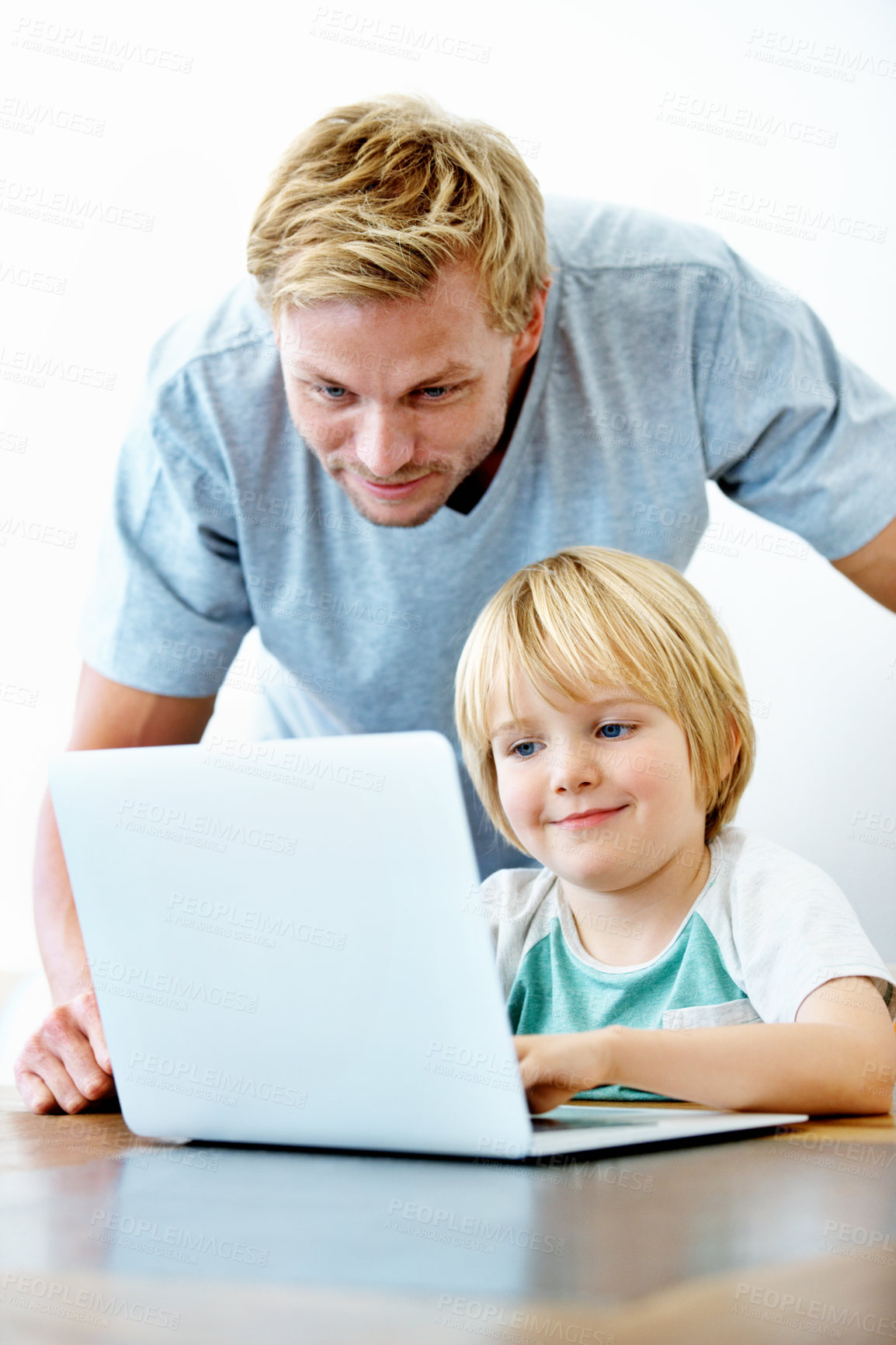 Buy stock photo Smile, laptop and support with father and child for education, homework and kindergarten project. Learning, knowledge and pre school prep with man and boy in family home for online tutor and help