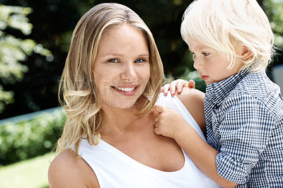 Buy stock photo Pretty young mother in the summer sunshine outdoors with her little boy
