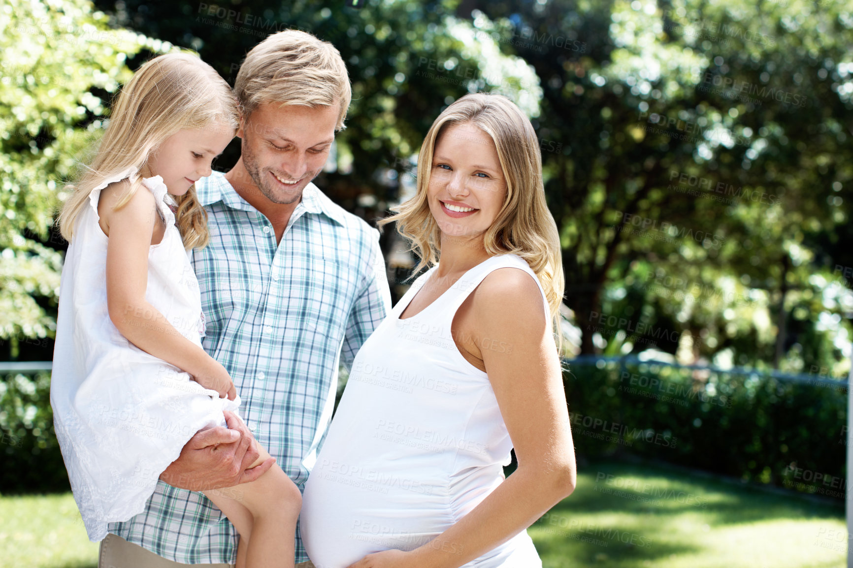 Buy stock photo Smile, father and child in nature with pregnant woman, love and summer holiday for bonding together. Portrait, parents and happy at park with daughter, maternity and weekend break for family vacation