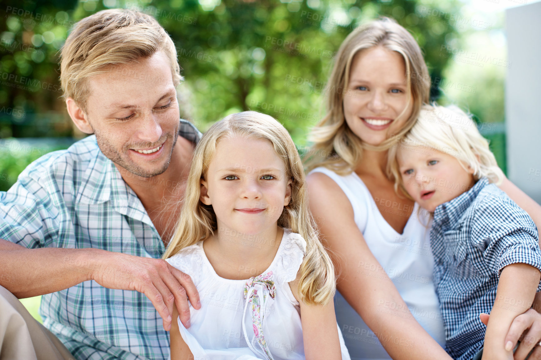 Buy stock photo Happy, parents and children with love in backyard for weekend break, bonding together and support. Care, people and kids portrait in home garden for family connection, healthy relationship and trust