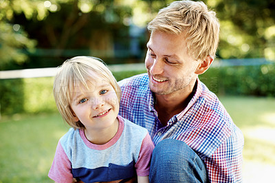 Buy stock photo Cute little boy playing in a garden with his dad during the summertime