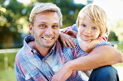 Buy stock photo Cute little boy playing in a garden with his dad during the summertime
