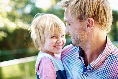 Buy stock photo Cute little boy playing in a garden with his dad during the summertime